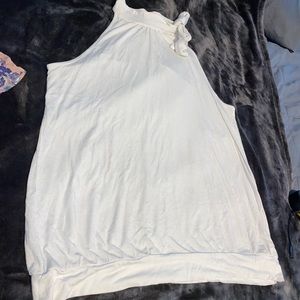 Sleeveless top with tie on neck.